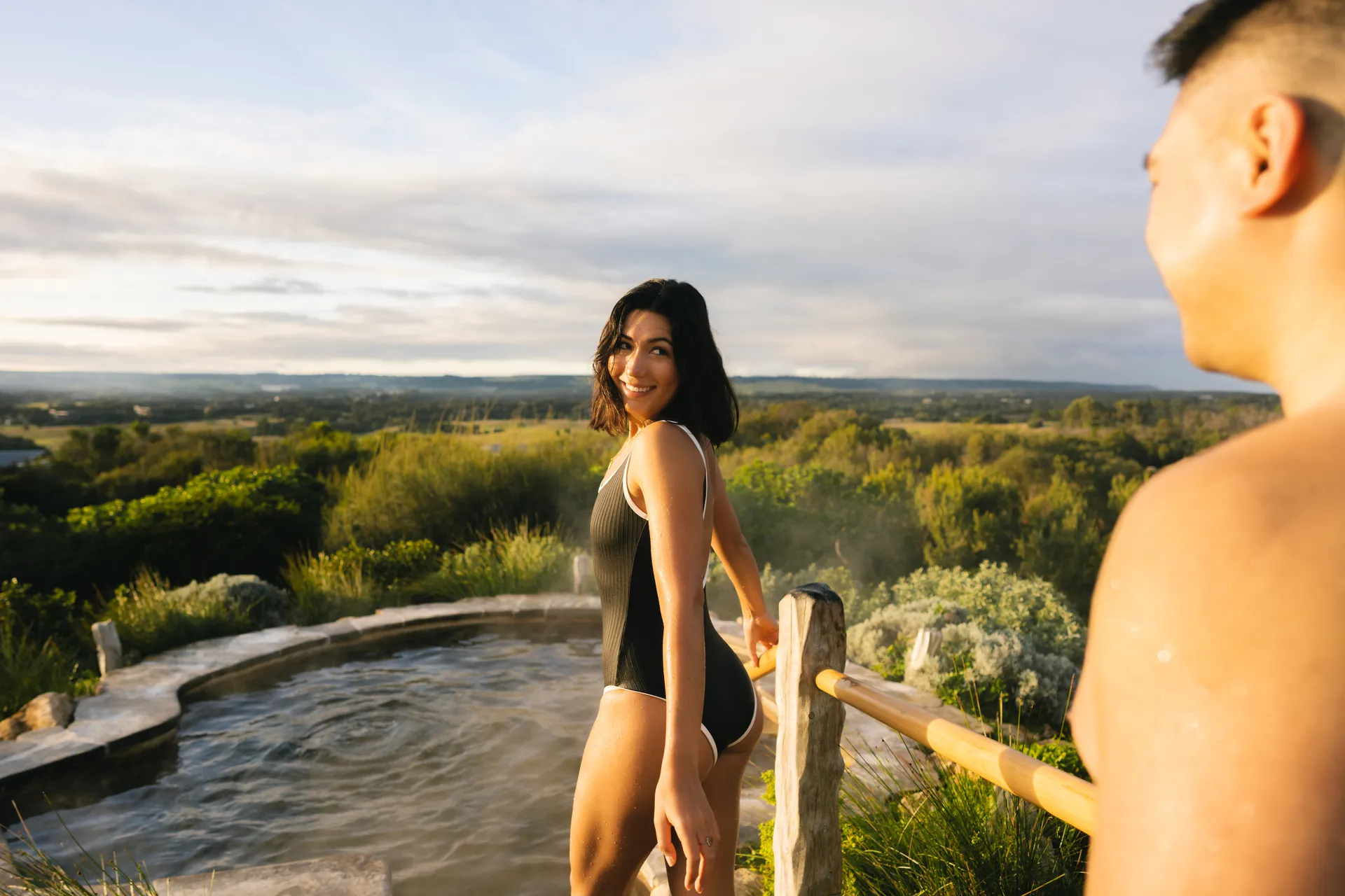 Stepping into the hot springs bath