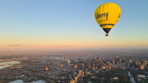 Guests in the balloon basket at dawn