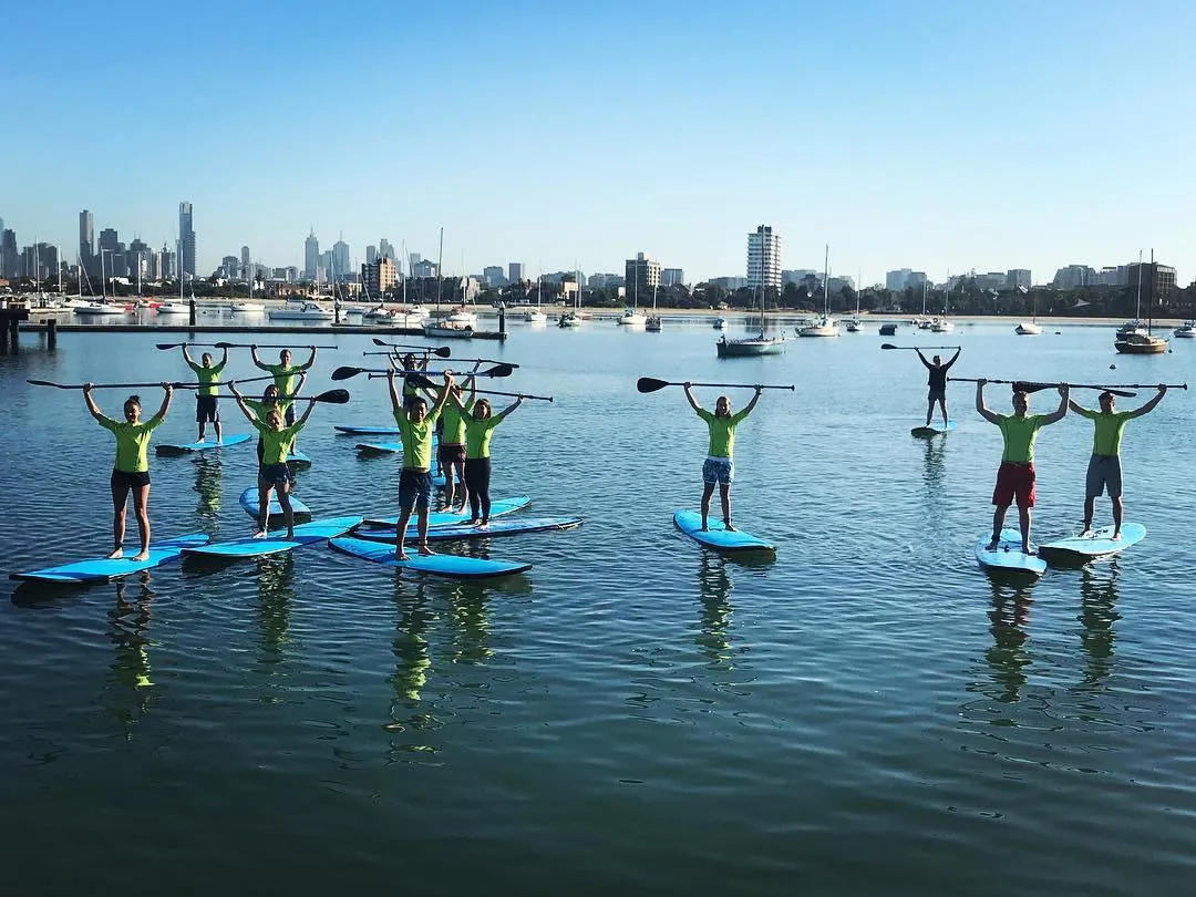 Open group stand up paddleboarding at St Kilda